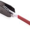 Angled view of the red-handled compact ratcheting brake spreader showing the black contact plates.
