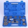 Open blue blow-molded case displaying the complete 12-piece brake caliper wind-back tool set, showing the main tool and various adapter plates.