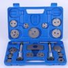 Open blue blow-molded case displaying the complete 18-piece brake caliper wind-back tool set, highlighting the two main tools and numerous adapter plates.