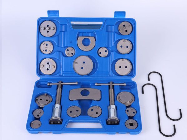 Open blue blow-molded case displaying the complete 21-piece brake caliper wind-back tool set, highlighting the two main tools, numerous adapter plates, and the two black S-hooks on the side.