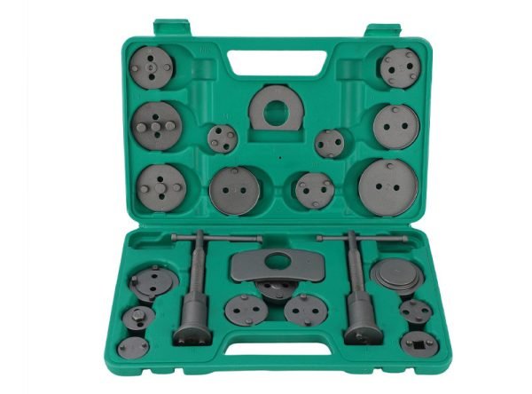 Open green blow-molded case displaying the complete 22-piece dual-spindle brake caliper wind-back tool set.