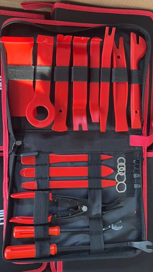 Full view of the 19-piece red and black trim removal tool set open on a clean white background.