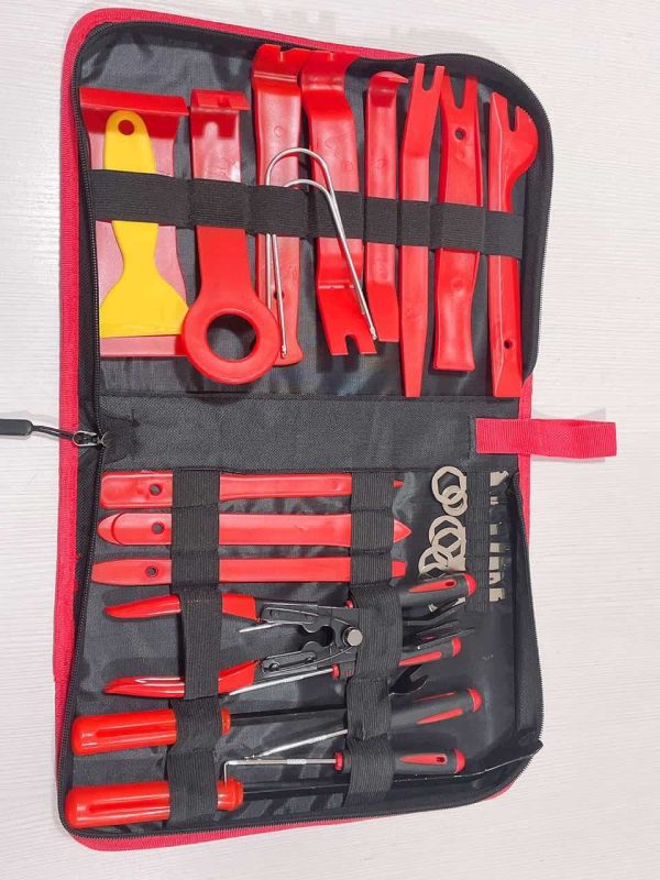 Full 30-piece tool set displayed open on a white background, showing all red plastic tools, metal levers, and precision pins neatly arranged in the black zippered case.