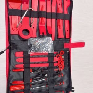 Top-down view of the 45-piece master kit laid out, highlighting the spring-loaded airbag pullers, metal pry bars, and the wire puller loop.