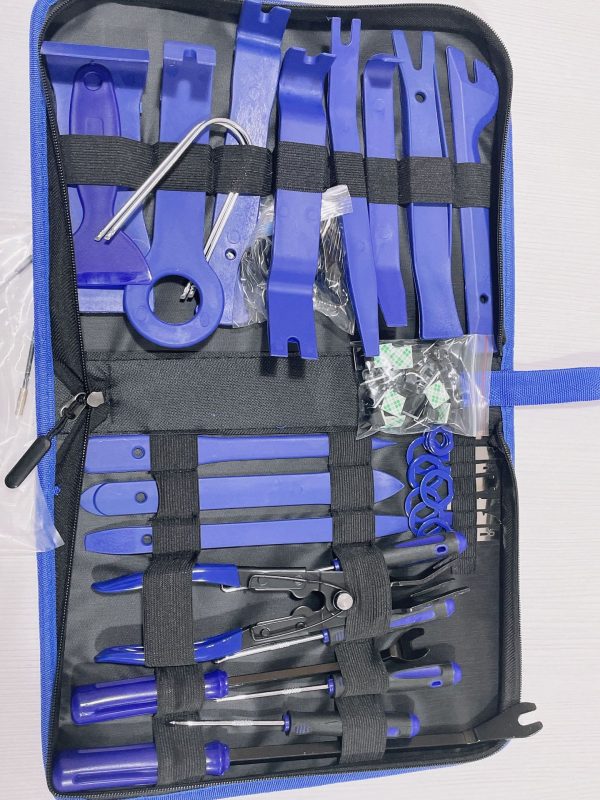 Top-down view of the 68-piece master kit laid out, showcasing the massive array of blue nylon tools, heavy-duty metal pry bars, and wire strippers in the black zippered bag.