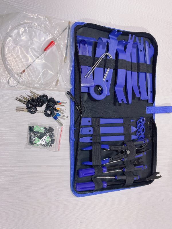 Top-down view of the 70-piece master kit, highlighting the bag of replacement hardware clips, the extended fish tape, and the blue nylon tools.