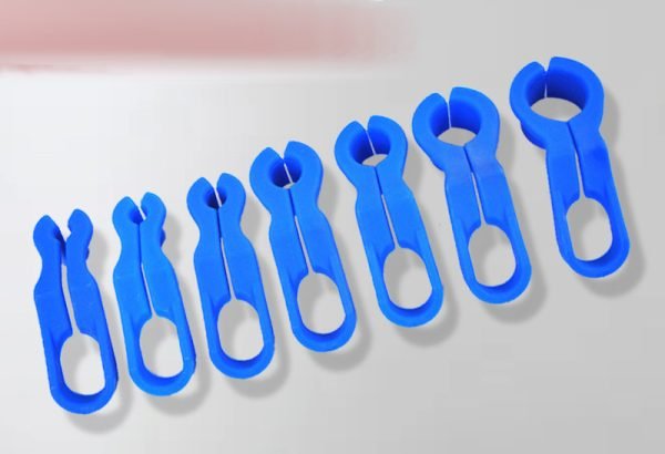 Set of 7 blue plastic fuel line disconnect tools in various sizes ranging from 1/4 inch to 7/8 inch, used for removing automotive quick release connectors and AC lines.