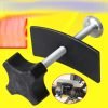 Full view of the black and silver brake caliper press tool showing the cross-handle and curved pressure plate.