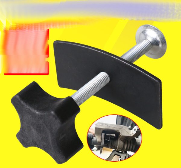 Full view of the black and silver brake caliper press tool showing the cross-handle and curved pressure plate.