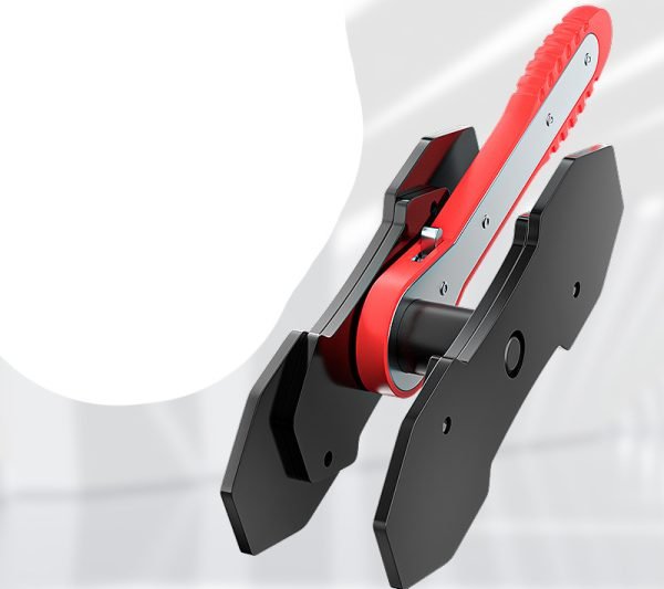 Full view of the red and black ratcheting brake caliper spreader with its two magnetic plates.