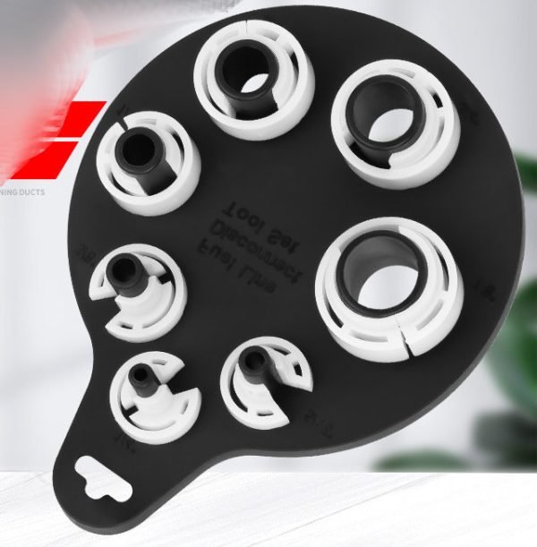 Seven piece white and black plastic fuel line disconnect tool set on a hanging board, sizes from 1/4 inch to 7/8 inch, used for removing car AC and fuel line quick connectors.
