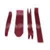 Set of four red plastic car interior trim removal pry tools including a curved bar, wide scraper, forked clip remover and long straight pry bar on a white background.