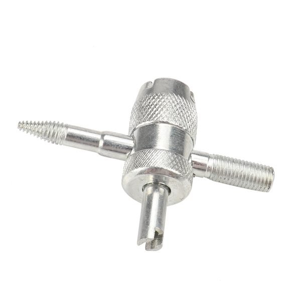 Silver 4-in-1 knurled valve core tool with a pointed threaded tip and six red rubber tire valve cores laid out below, used for car, truck, motorcycle and bike tires.
