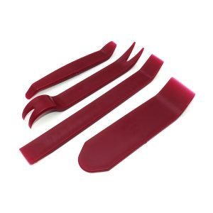 Set of four red plastic car interior trim removal pry tools including a curved bar, wide scraper, forked clip remover and long straight pry bar on a white background.