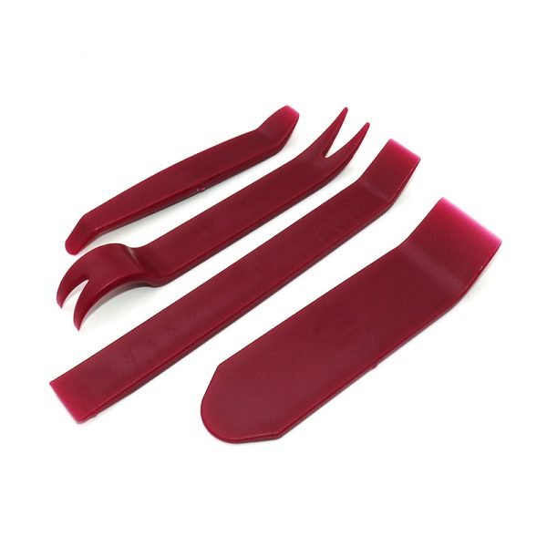 Set of four red plastic car interior trim removal pry tools including a curved bar, wide scraper, forked clip remover and long straight pry bar on a white background.