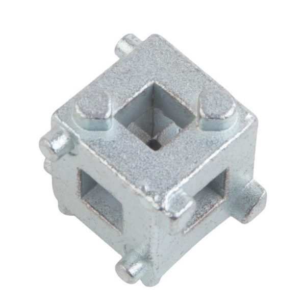 Close-up of the silver 34mm multi-functional brake wind-back adapter cube held in a hand to show scale.