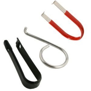 Three specialized lug nut and valve cap removal tools (red, black, and silver) laid out against a clean white background.