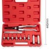 Open red case displaying an 11-piece valve stem seal tool kit with black pliers and chrome adapters organized by size.