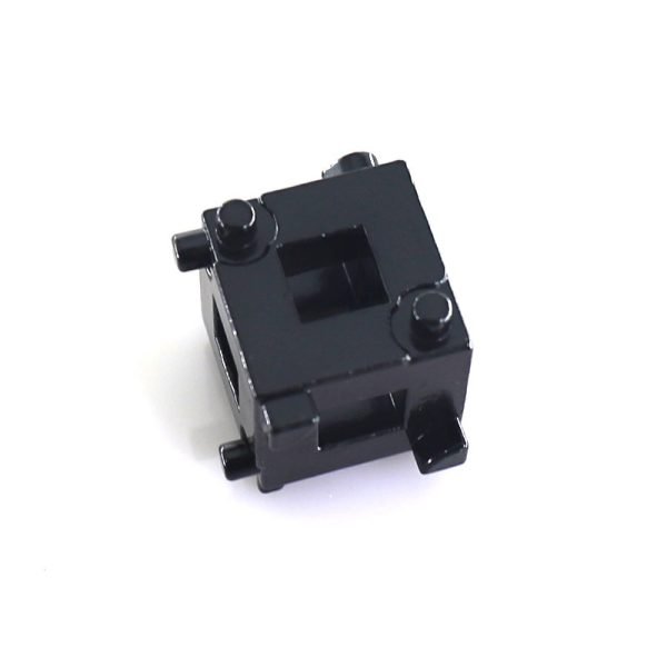 High-quality studio shot of the black 34mm multi-functional brake wind-back adapter cube against a clean white background.