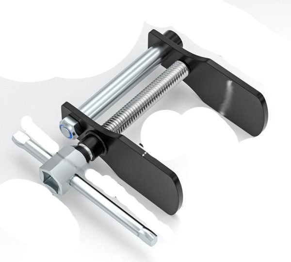 Full view of the silver and black duck-jaw brake caliper spreader showing the T-handle and wide jaw opening.