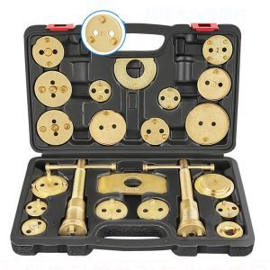 Open black blow-molded case displaying the complete 22-piece gold-plated brake caliper wind-back tool set.