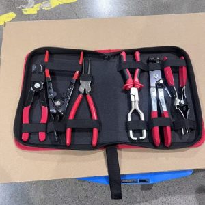 A professional 6-piece headlight removal and hose clamp pliers kit neatly organized in a black and red zippered carrying case.
