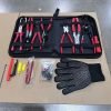 An open view of the Ultimate 8-Piece Automotive Pliers Set showing red-handled pliers, a terminal removal kit, and safety gloves laid out on cardboard.