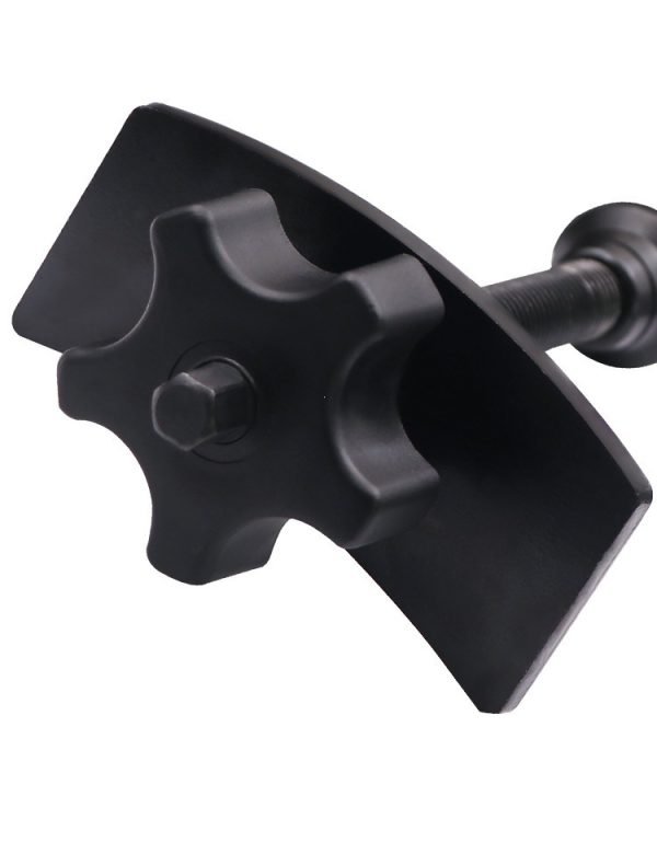 Full view of the black brake caliper press tool showing the ergonomic nylon knob and curved pressure plate.