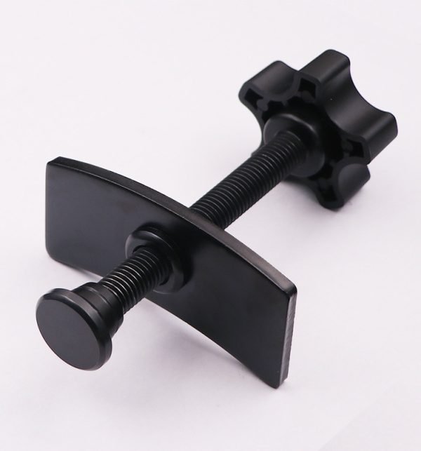 Full view of the black brake caliper press tool showing the ergonomic nylon knob and curved pressure plate.