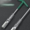 T-handle spark plug wrench with green handle and silver spring guard, displayed diagonally on a dark background.
