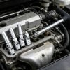 Full layout of the 11-piece chrome vanadium socket set, including flex-head universal joints, deep spark plug sockets, extension bars, and a spark plug extractor tool on a white background.