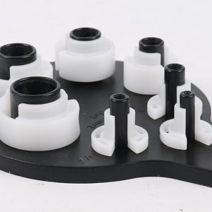 Seven piece white and black plastic fuel line disconnect tool set on a hanging board, sizes from 1/4 inch to 7/8 inch, used for removing car AC and fuel line quick connectors.