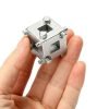 Close-up of the silver 34mm multi-functional brake wind-back adapter cube held in a hand to show scale.