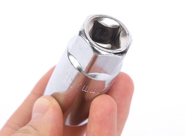 A single 16mm chrome spark plug socket with a 1/2" drive base, displayed against a white background, showcasing its heavy build and mirror polish.