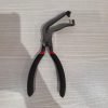 9-piece red and black automotive repair tool set featuring long nose pliers, hose clamp pliers, cutters, and a black anti-slip mechanic glove arranged on a white background.