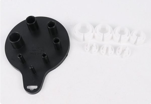 Seven piece white and black plastic fuel line disconnect tool set on a hanging board, sizes from 1/4 inch to 7/8 inch, used for removing car AC and fuel line quick connectors.