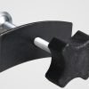 Full view of the black and silver brake caliper press tool showing the cross-handle and curved pressure plate.