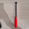 9-piece red and black automotive repair tool set featuring long nose pliers, hose clamp pliers, cutters, and a black anti-slip mechanic glove arranged on a white background.