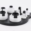 Seven piece white and black plastic fuel line disconnect tool set on a hanging board, sizes from 1/4 inch to 7/8 inch, used for removing car AC and fuel line quick connectors.